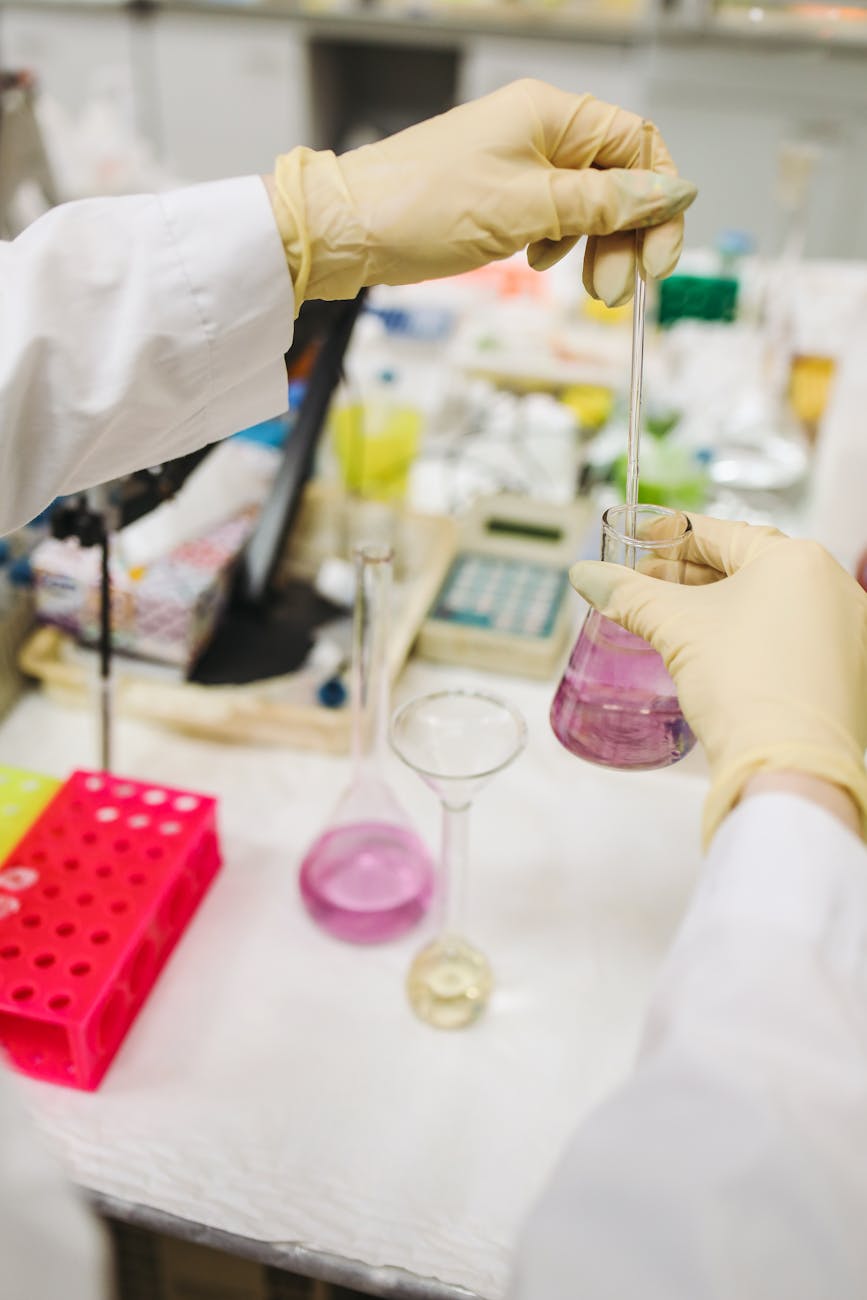 a photograph of a chemist wearing gloves